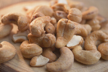 Cashews on wooden surface ready for snacking or cooking