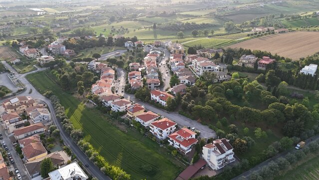 Aerial photo of houses, roofs, streets and greenery and a beautiful view in the Italian town of Roseto degli Abruzzi in the province of Teramo.

