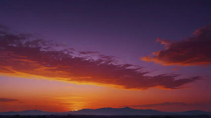 Obraz premium A smooth gradient transitioning from deep orange to soft purple, evoking the colors of a serene sunset with a dreamy, abstract feel.