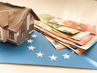 Model house on euro banknotes background