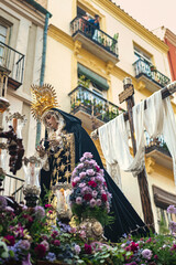 Throne of the Virgin Mary with crown of thorns in Holy Week procession in Malaga Spain.