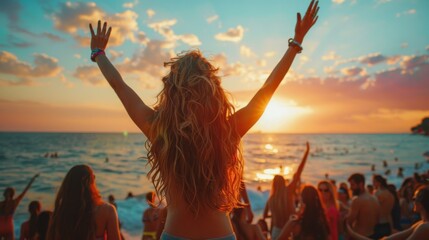 A group of friends, including joyful young women, dances at a beach festival. The crowd enjoys the music and the sunset