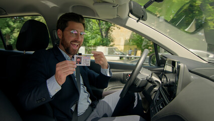 Happy smile man Caucasian male guy businessman in own car drive city road demonstrate driver...