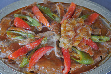 iskender Doner Kebab with butter, tomato sauce and yoghurt, Turkish Traditional meal