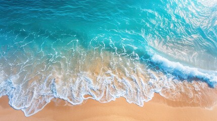 Fototapeta premium Drone shot of a beautiful tropical beach. The clear blue sea sparkles under the sun, waves gently rolling onto the sandy shore. A perfect scene
