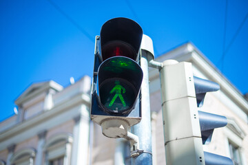 A green light for pedestrians in Helsinki city centre during spring time