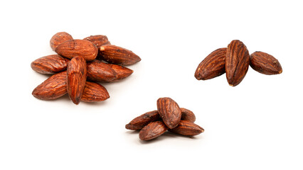 A group of caramelized almonds isolated on a white background.