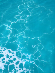 Obraz premium Pure blue turquoise water texture of the ocean sea with foam from and waves