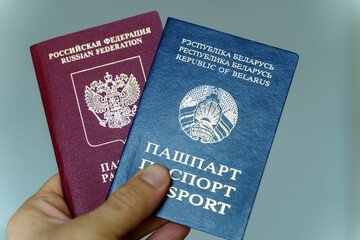 Belarusian and Russian passport. Citizenship of Russia and Belarus. Emigration, travel, work concept