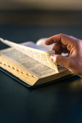 Fototapeta premium Open Bible close-up. Christianity concept. Reading God's Holy Bible.