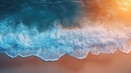 Stunning aerial shot of ocean waves breaking on a sandy beach at sunset, showcasing vibrant turquoise water and warm golden sand.  Perfect for travel, vacation, or summer themes.