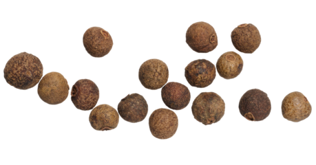 Dried allspice berries scattered on a white background