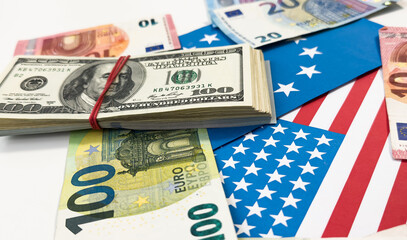 us and european union flags with euro and dollar banknotes 