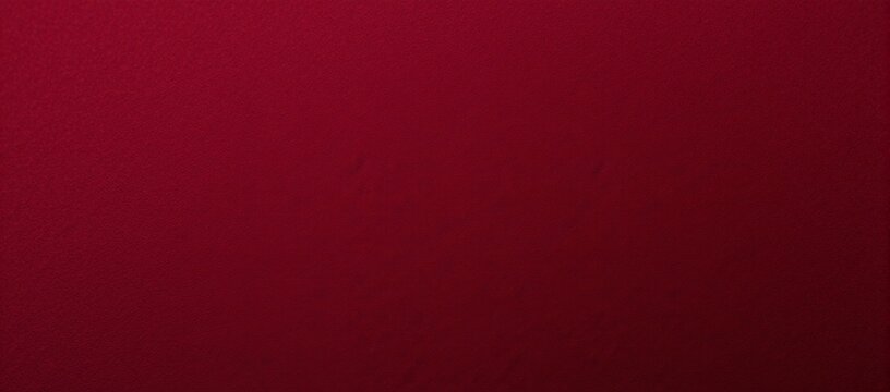 Close-up detail on dark red suede fabric with rich velvet texture and seamless wine-colored textile