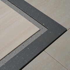 Fototapeta premium Gray-toned natural marble slab tile backdrop featuring concrete textures on both stone and cement surfaces