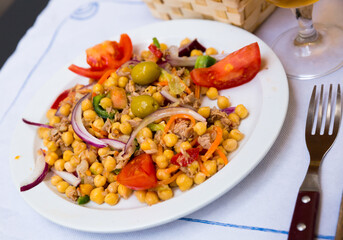 Spanish cuisine - salad with garbanzos and olives. High quality photo