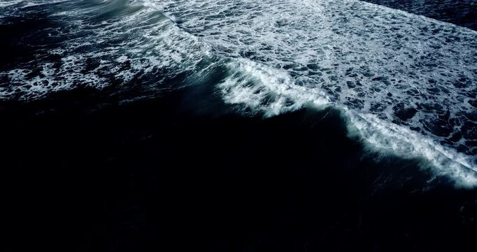 Cinematic sea water wave rolling foamy Aerial view scene in dark sea