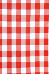 A classic gingham checkered pattern in bright red and white, evoking summer picnic vibes. The clean lines and symmetry make it a timeless and versatile design.