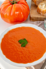 Famous vegetables soup from Cordoba, Andalusia salmorejo served cold in restaurant for lunch as starter dish close up