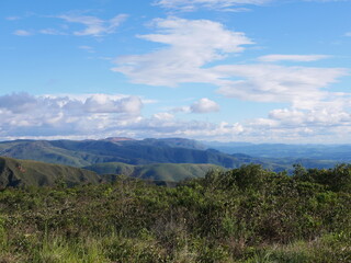 Rolling green hills and vast landscapes of Serra do Rola-Moça National Park in Brazil. The park protects biodiversity and offers scenic views of mountains and valleys in Minas Gerais, Brazil