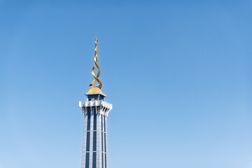 Modern Spiral Tower Against a Clear Blue Sky in Minimalist Style
