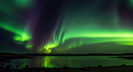 Naklejka premium Aurora Borealis Over Lake: Witness the ethereal dance of the Aurora Borealis.