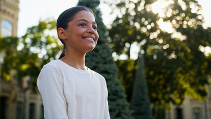 Multiethnic young little girl american indian latino student gen z teenager smiling happy...