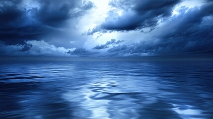Fototapeta premium A dramatic ocean scene with storm clouds above, dark blue water reflecting the moody sky.