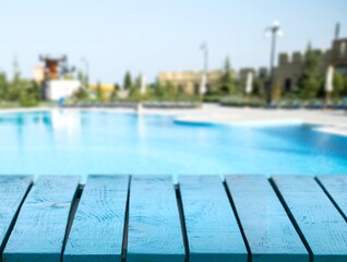 Wooden top with Swimming pool background