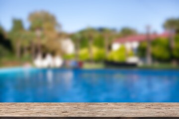 Wooden top with Swimming pool background