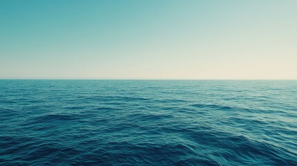 Obraz premium A peaceful seascape with crystal-clear turquoise water stretching to the horizon, bright sky above.