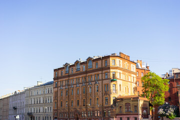 Minimalist architecture building facade of old historic house exterior. Decorative ornamental design elements of classic European style apartment building front view