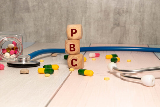 PBC Primary biliary cholangitis - word from wooden blocks with letters