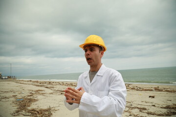 Engineer Angry About Bad Work Done By Workers Nervously Scolding Them On Beach