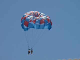 paragliding in the blue sky