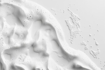 Dense white foam with many air bubbles flowing across surface