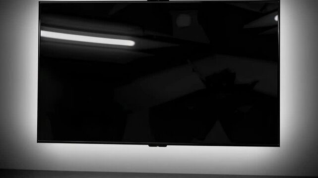 A sleek, modern flat-screen TV mounted on a wall, captured from a low-angle view, emphasizing its minimalist design and video display capabilities.