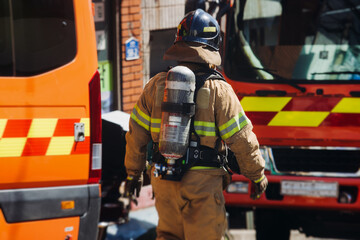 Group of South Korean fire men during fire fighting operation in the streets, firefighters with...