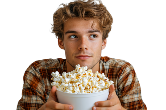 Young man thinks while eating popcorn