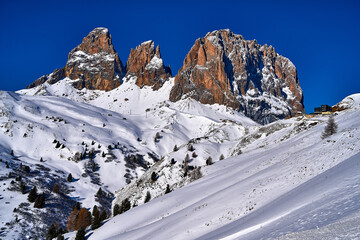 Beautiful panoramic view to the Sellaronda - the ski circuit around the Sella group in Dolomites, Italy - Badia, Gherdeina, Fascia. Extraordinary snowy peaks of the dolomites, southern Alps.