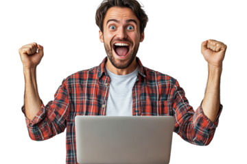 Excited man celebrates success with laptop at home