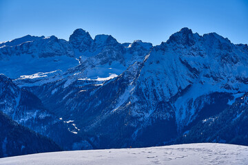 Beautiful panoramic view to the Sellaronda - the ski circuit around the Sella group in Dolomites, Italy - Badia, Gherdeina, Fascia. Extraordinary snowy peaks of the dolomites, southern Alps.