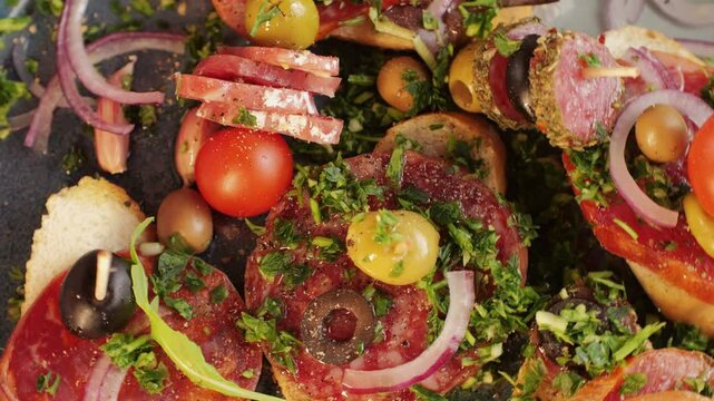 Tapas, Mix of spanish pork sausages, Cutting board of appetizing catalonian snack - fuet, jamon, chorizo, olives, supermarket tapas food in spain, traditional cuisine. 