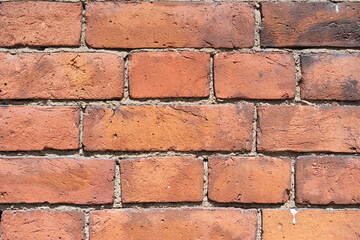 Obraz premium Empty brick red wall. background of a old brick house.