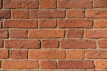 Empty brick red wall. background of a old brick house.