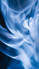 Obraz premium Blue Swirling Smoke Shows Graceful Shapes and Soft Movement Patterns