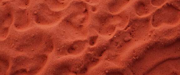 Top-down view of red sand texture
