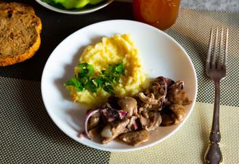 Fried mushrooms with mashed potatoes. Russian cuisine