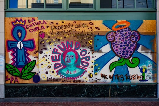 Colorful mural on plywood board, advocating for social justice and human rights. created this piece. Black Lives Matter protest activism, Oakland, California, USA, 18 June 2020
