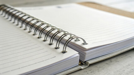 Empty spiral notebook on wooden table, ready for notes and ideas